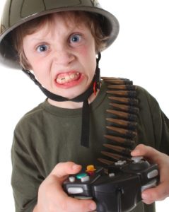 boy with helmet and video game controller